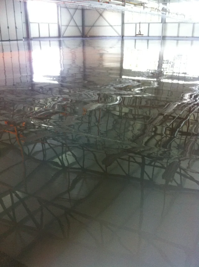 Interior view of the steel hall in Călărași, with structural bracing and the floor surface.